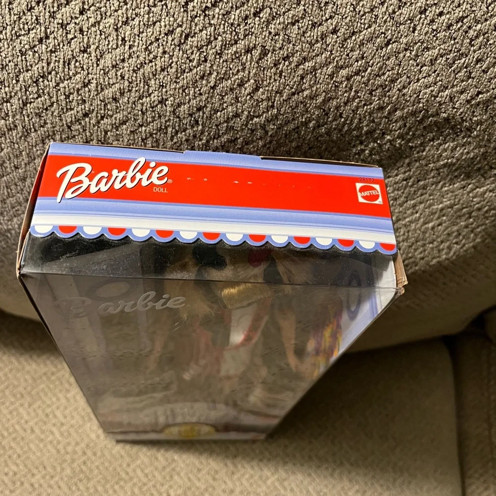Disney exclusive Barbie.  Never been out of box.  Box has a crinkle as…